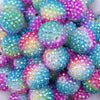 Close up view of a pile of 20mm Rainbow Confetti AB Rhinestone Bubblegum Beads 
