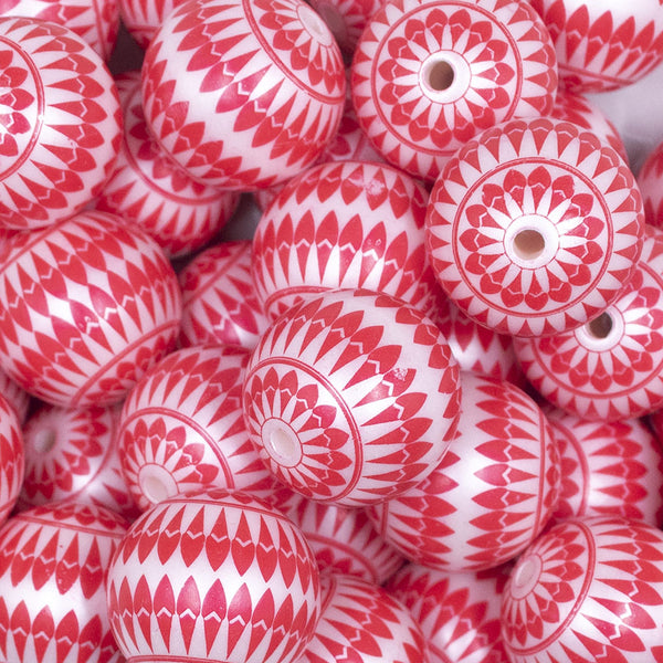 Close up view of a pile of 20mm Red with White Ornamental Printed Acrylic Bubblegum Beads
