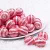 Front view of a pile of 20mm Red with White Ornamental Printed Acrylic Bubblegum Beads