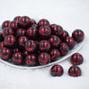 Front view of a pile of 20mm Red & Black PEARL Plaid Print Acrylic Bubblegum Beads