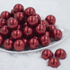 Front view of a pile of 20MM Seeds Print on Red pearl Chunky Acrylic Bubblegum Beads