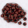 Top view of a pile of 20mm Orange & Black Stripe Acrylic Chunky Bubblegum Beads
