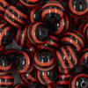 Close up view of a pile of 20mm Orange & Black Stripe Acrylic Chunky Bubblegum Beads