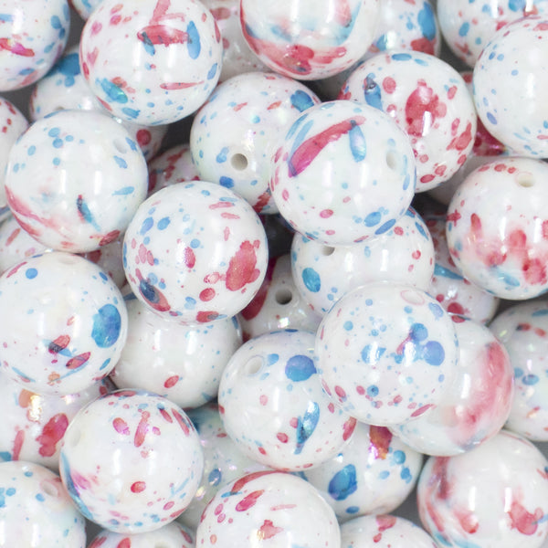 Close up view of a pile of 20mm Red & Blue Splatter AB Chunky Acrylic Bubblegum Beads