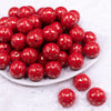 Front view of a pile of 20mm Red with Gold Spotted Print Acrylic Bubblegum Beads