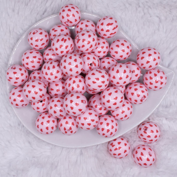 top view of a pile of 20mm Red Hearts on Pink Acrylic Bubblegum Beads