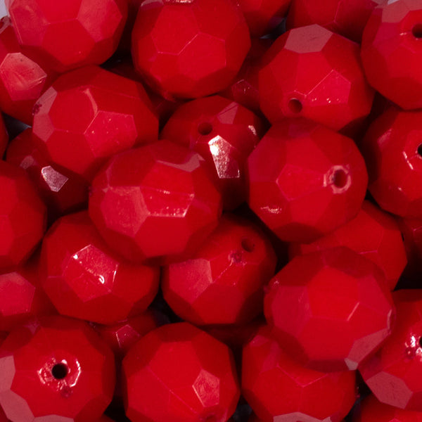 Close up view of a pile of 20mm Red Faceted Opaque Bubblegum Beads