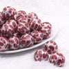 front view of a pile of 20mm Red Paisley printed Acrylic Bubblegum Beads