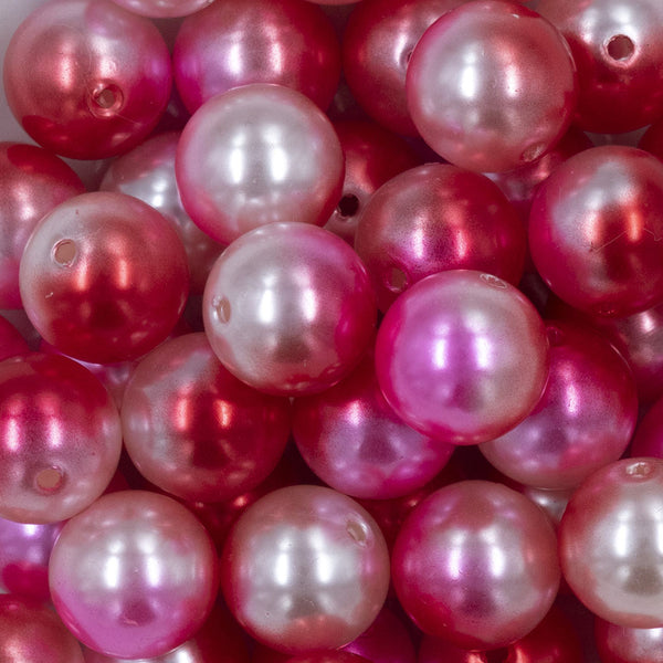 Close up view of a pile of 20mm Red & Pink Ombre Shimmer Faux Pearl Bubblegum Beads