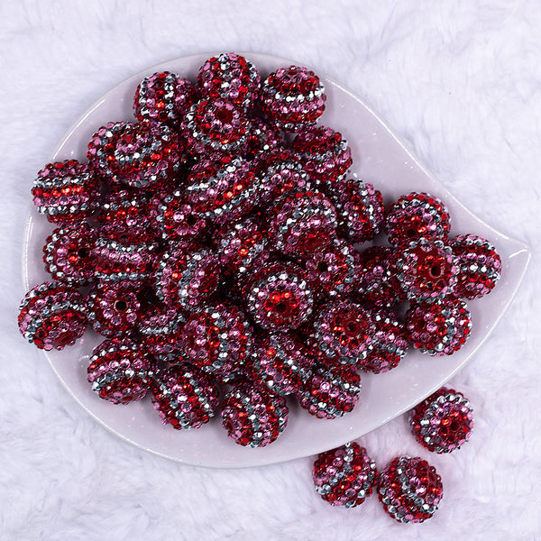 Top view of a pile of 20mm Pink, Red & Silver Striped Rhinestone AB Bubblegum Beads