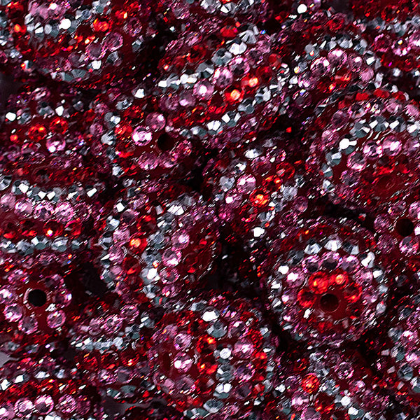 Close up view of a pile of 20mm Pink, Red & Silver Striped Rhinestone AB Bubblegum Beads