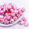 Front view of a pile of 20mm Red & Pink Splatter Chunky Acrylic Bubblegum Beads