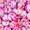 Close up view of a pile of 20mm Red & Pink Splatter Chunky Acrylic Bubblegum Beads