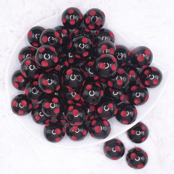 top view of a pile of 20mm Red Polka Dots on Black Bubblegum Beads