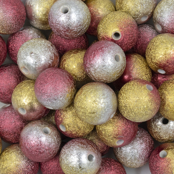 Close up view of a pile of 20mm Red, Gold & Silver Stardust Ombre Shimmer Bubblegum Beads