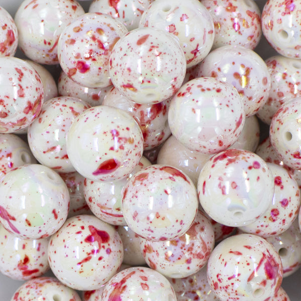 Close up view of a pile of 20mm Red & Pink Splatter AB Chunky Acrylic Bubblegum Beads