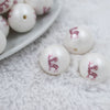 Micro view of a pile of 20mm Reindeer with red snowflake Print Chunky Acrylic Bubblegum Beads [10 Count]