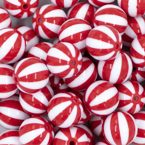 Close up view of a pile of 20mm Red with White Stripe Beach Ball Bubblegum Beads