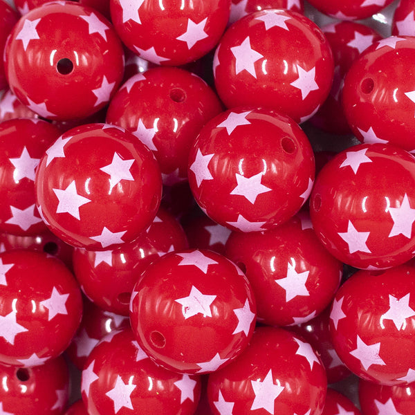 Close up view of a pile of 20mm Red with White Stars Acrylic Bubblegum Beads