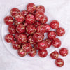 top view of a pile of 20mm Red and Gold Flake Resin Chunky Bubblegum Beads