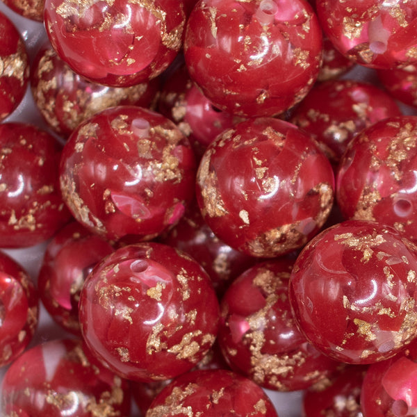 close up view of a pile of 20mm Red and Gold Flake Resin Chunky Bubblegum Beads