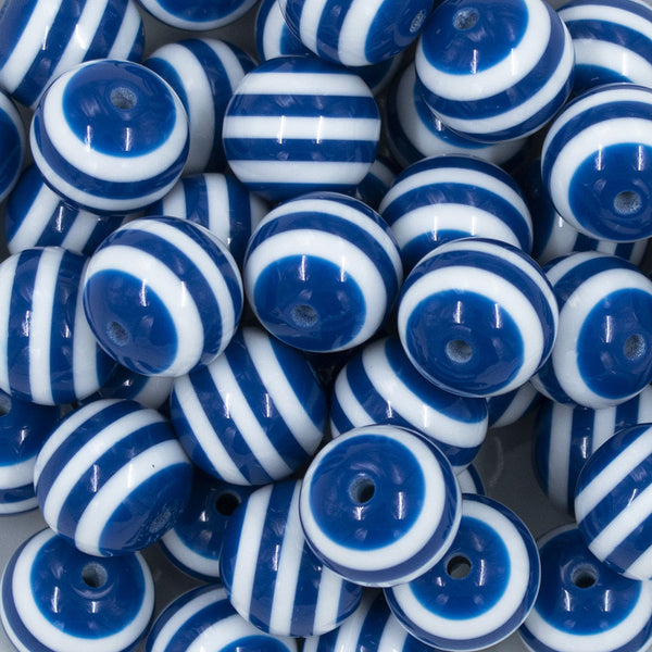 Close up view of a pile of 20mm Royal Blue with White Stripe Chunky Bubblegum Beads
