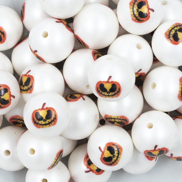 Close up view of a pile of 20mm Scary Jack O Lantern Face Print Chunky Acrylic Bubblegum Beads [10 Count]