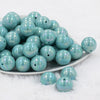 Front view of a pile of 20mm Seafoam Blue Solid AB Bubblegum Beads