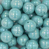 Close up view of a pile of 20mm Seafoam Blue Solid AB Bubblegum Beads