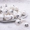 front view of a pile of 20MM White Skull Face Halloween Bubblegum Beads