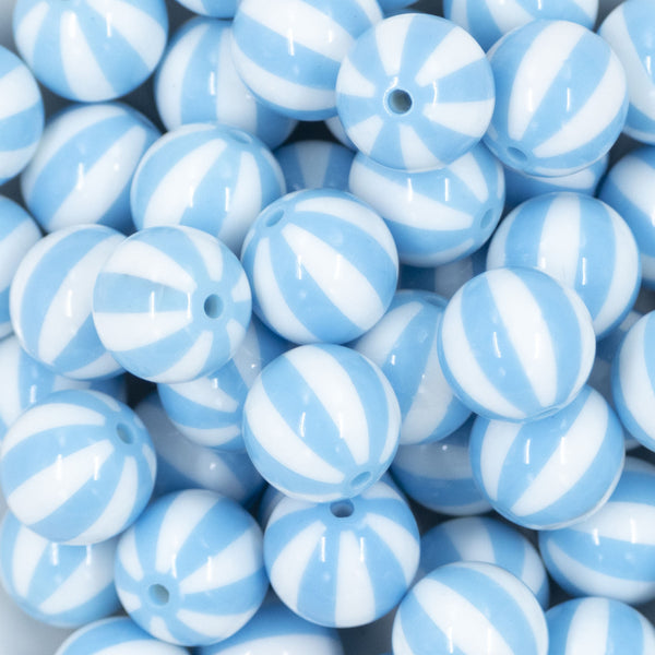 Close up view of a pile of 20mm Sky Blue with White Stripe Beach Ball Bubblegum Beads