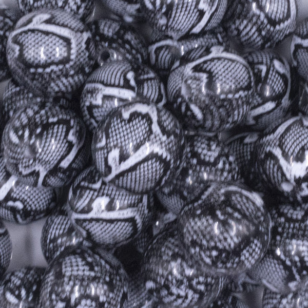 close up view of a pile of 20mm Black & White Snake Print Bubblegum Beads