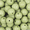 Close up view of a pile of 20mm Pistachio Green Solid Chunky Acrylic Bubblegum Beads