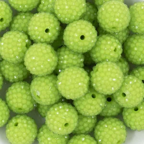 Close up view of a pile of 20mm Sour Apple Green Rhinestone Bubblegum Beads20mm Sour Apple Green Rhinestone Bubblegum Beads