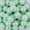 Close up view of a pile of 20MM Spearmint Green AB Solid Chunky Bubblegum Beads