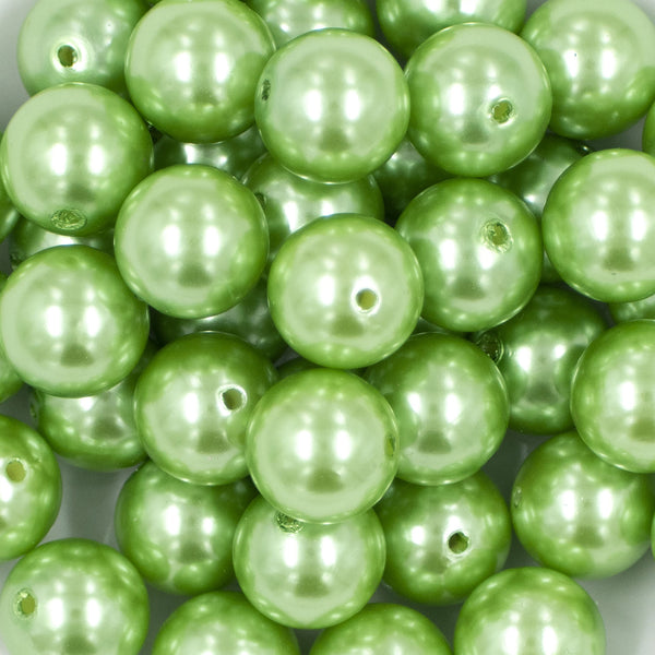 Close up view of a pile of 20mm Spring Green Faux Pearl Bubblegum Beads