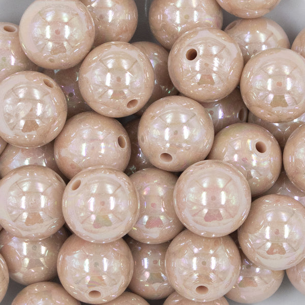 Close up view of a pile of 20MM Tan AB Solid Chunky Bubblegum Beads