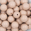 Close up view of a pile of 20mm Tan Solid Chunky Acrylic Bubblegum Beads
