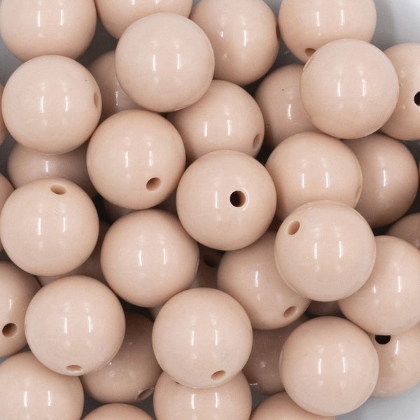 Close up view of a pile of 20mm Tan Solid Chunky Acrylic Bubblegum Beads