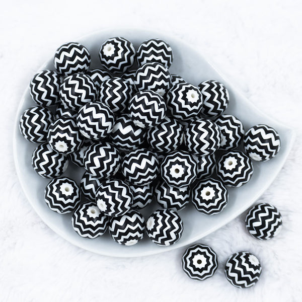 Top view of a pile of 20mm Black with Silver Chevron Bubblegum Beads