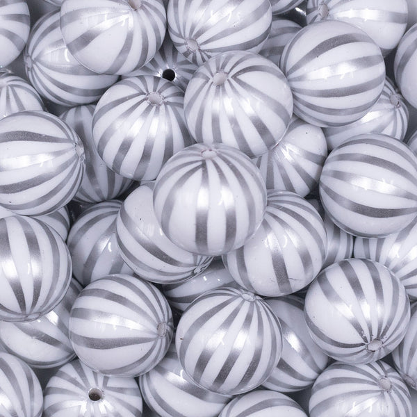 Close up view of a pile of 20mm White with Silver Pin Stripes Acrylic Bubblegum Beads