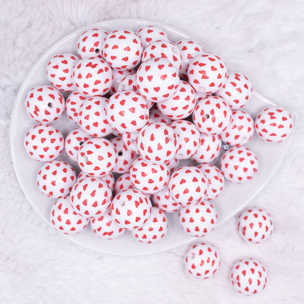 top view of a pile of 20mm Red Confetti Hearts on White opaque Acrylic Bubblegum Beads