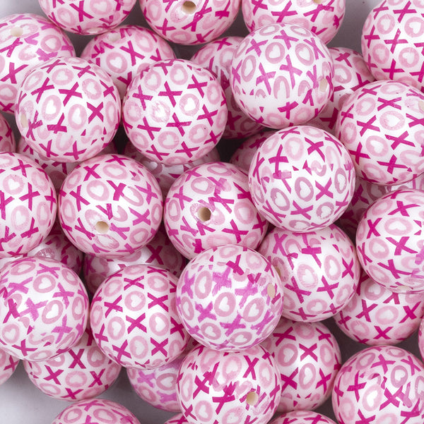 Close up view of a pile of 20mm X's & O's Acrylic Bubblegum Beads