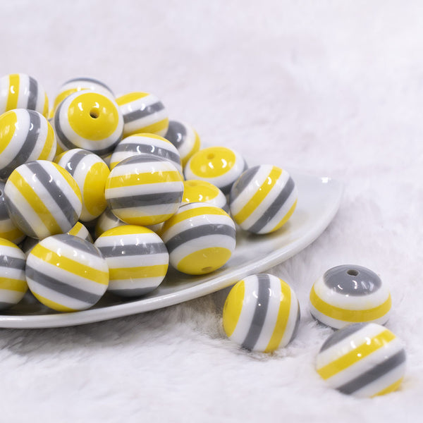 Front view of a pile of 20mm Yellow, Gray & White Stripes Chunky Bubblegum Jewelry Beads