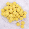 top view of a pile of 20mm Yellow Sequin Confetti Bubblegum Beads