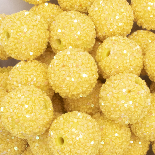 close up view of a pile of 20mm Yellow Sequin Confetti Bubblegum Beads