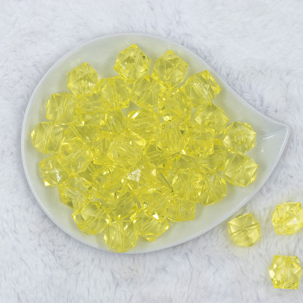 Top view of a pile of 20mm Yellow Transparent Cube Faceted Pearl Bubblegum Beads