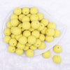 Top view of a pile of 20mm Yellow Sugar Glass Bubblegum Beads