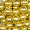 Close up view of a pile of 20mm Yellow with Glitter Faux Pearl Bubblegum Beads