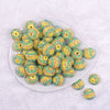 Top view of a pile of 20mm Yellow Pastel Striped Rhinestone AB Bubblegum Beads